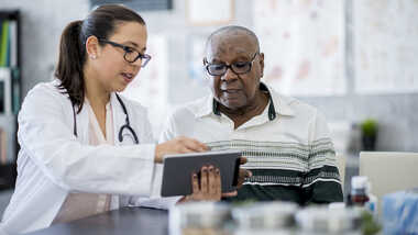 Doctor consulting with patient in a clinical setting